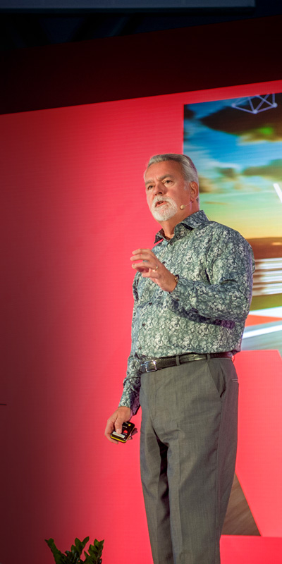 Richard West Keynote Speaker, Event Host & Facilitator, F1 backdrop Photo