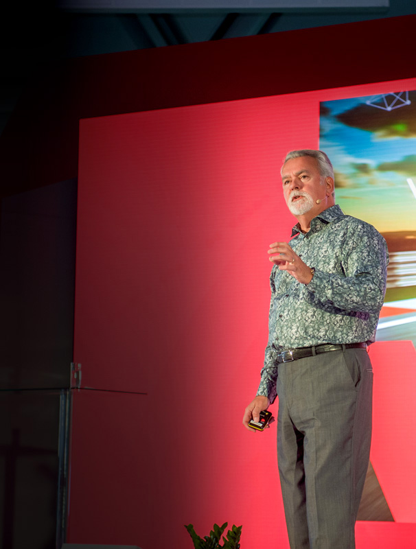 Richard West Keynote Speaker, Event Host & Facilitator, F1 backdrop Photo